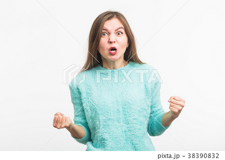 portrait of young angry woman on white background portrait of young angry woman on white background 38390832
