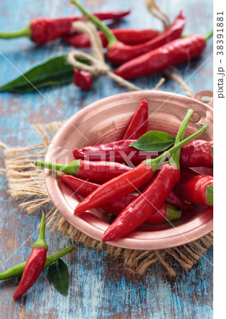 Chili peppers in a copper pot 38391881