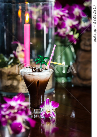 Still life Iced coffee with cream orchid flowers Still life Iced coffee with cream orchid flowers 38392817
