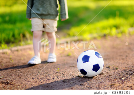 boy having fun playing a soccer/football game 38393205