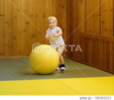 Active preschool boy playing with big ball Active preschool boy playing with big ball 38393221