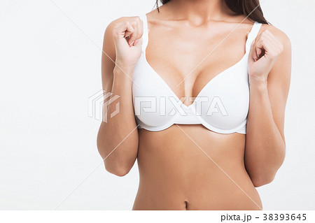 Girl Showing Breast In White Bra Stock Photo, Picture and Royalty