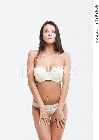Young sexy brunette in white swimsuit Young sexy brunette in white swimsuit 38393696