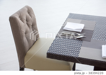 Luxurious fork and spoon on the dining table 38394220