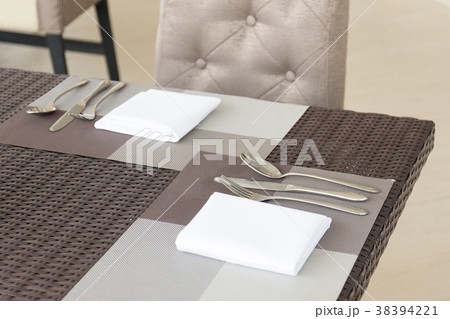 Luxurious fork and spoon on the dining table 38394221