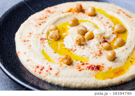 Hummus, chickpea dip, with spices and pita 38394790