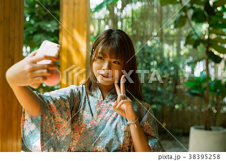 Lifestyle series: Asian woman taking selfie Lifestyle series: Asian woman taking selfie 38395258