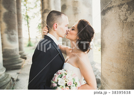 Portrait of happy wedding couple with head to head 38395638