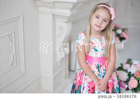 Portrait of little smiling girl child in colorful 38396376
