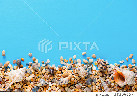 Blue background with pebble and shells 38396657
