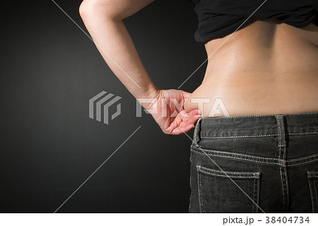 女性 メタボ お腹 贅肉 腰の写真素材