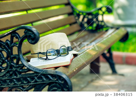 an open novel book, stylish glasses 38406315