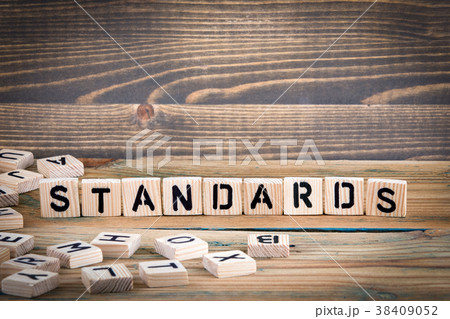 standards. Wooden letters on the office desk, informative and communication background 38409052