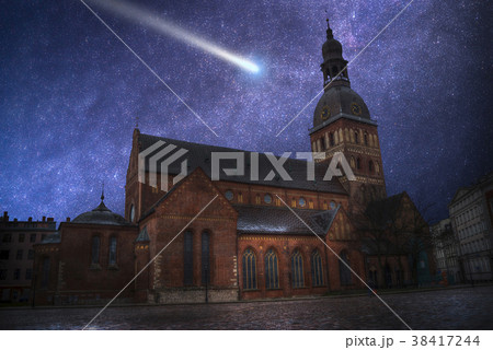 comet flies in the night sky 38417244