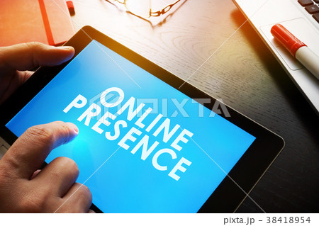 Man is holding report about Online Presence. 38418954