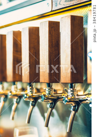 Beer taps in a pub Beer taps in a pub 38419781