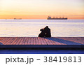 couple on the waterfront in golden hour  38419813