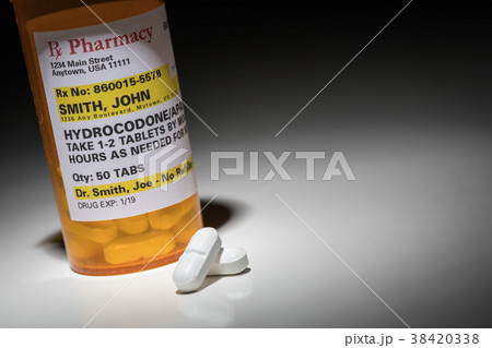 Hydrocodone Pills and Prescription Bottle  38420338