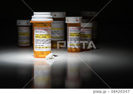 Hydrocodone Pills and Prescription Bottle  38420347
