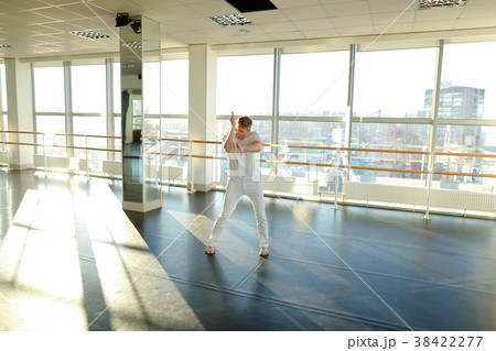 Choreographer in sportswear selecting moves for 38422277