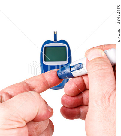 Man use a blood glucose meter 38422480