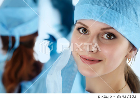 Close up portrait of young female surgeon doctor 38427102