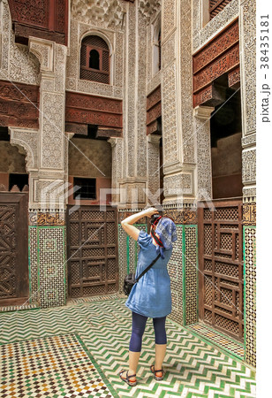 Tourist taking pictures inside the Koranic School in Meknes Tourist taking pictures inside the Koranic School in Meknes 38435181