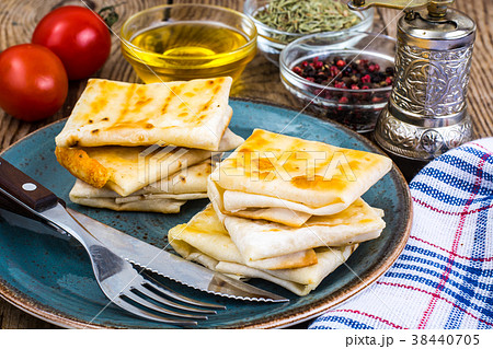 Envelopes of thin Armenian bread lavash fried with Envelopes of thin Armenian bread lavash fried with 38440705