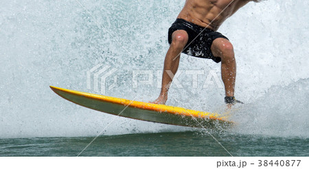 A surfer enjoying life in the tropics 38440877