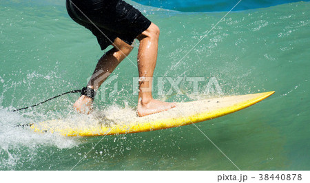 Surfer riding a wave 38440878