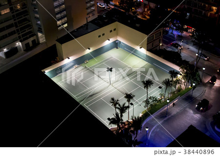 Tennis courts at night from above 38440896