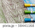 Yellow, green and blue marker on wooden background 38441168