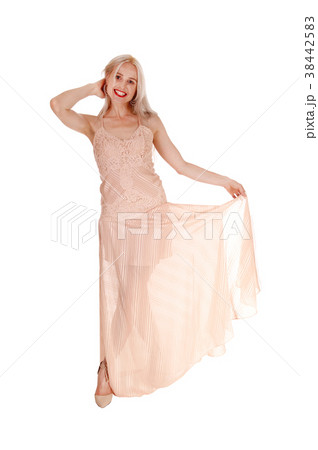 Beautiful blond woman in pink dress 38442583