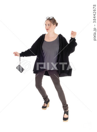 Serious looking woman sitting on floor Serious looking woman sitting on floor 38442678