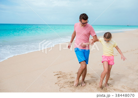 Family fun on white sand. Smiling father and Family fun on white sand. Smiling father and 38448070