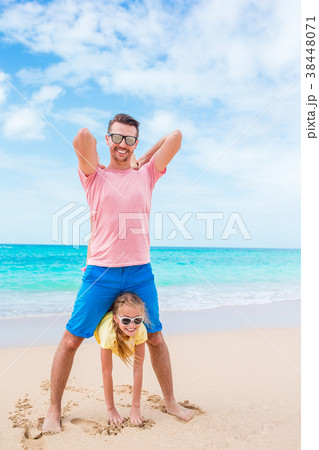 Family fun on white sand beach 38448071