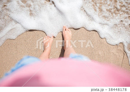 Close up of female feet on white sandy beach Close up of female feet on white sandy beach 38448178