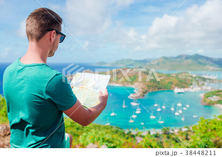 Young tourist man with map background of English 38448211