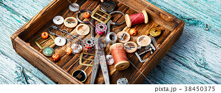 Sewing buttons and spools of thread Sewing buttons and spools of thread 38450375