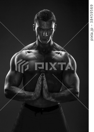 Dirty muscle man in pose on BW photo. Pray Dirty muscle man in pose on BW photo. Pray 38459569