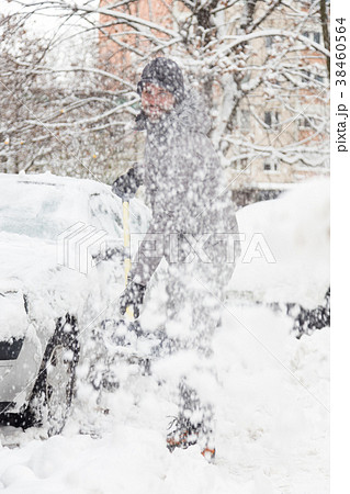 Man shoveling snow in winter. 38460564