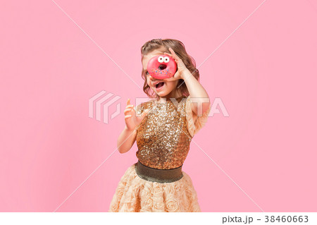 Girl looking through donut hole Girl looking through donut hole 38460663