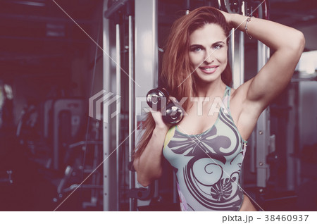 Sexy athletic young girl working out in gym 38460937