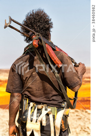 a black soldier and his gun looking the boarder a black soldier and his gun looking the boarder 38460982
