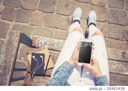 Woman using modern white smartphone. Top view 38461436