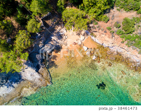 Aerial view of sandy beach with rocks and water 38461473