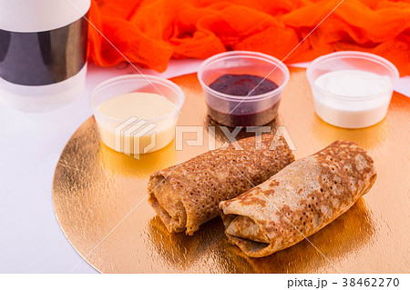 Pancakes with stuffing, are served with sour cream Pancakes with stuffing, are served with sour cream 38462270
