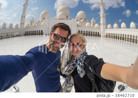 Couple taking selfie in Sheikh Zayed Grand Mosque Couple taking selfie in Sheikh Zayed Grand Mosque 38462710