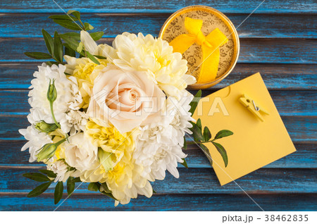 Yellow pink bouquet flowers on blue 38462835