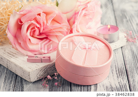 Pink gift box, roses, lit candle 38462838
